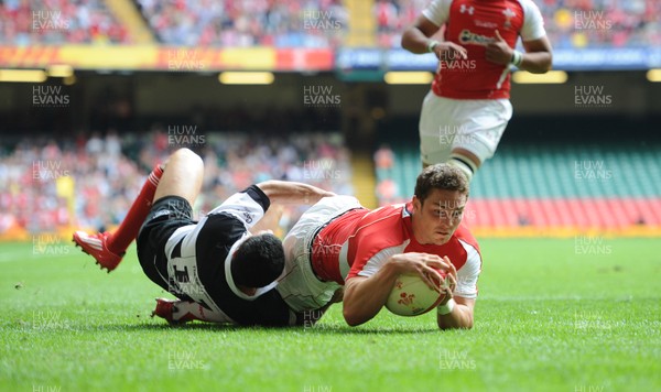 04.06.11 - Wales v Barbarians - DHL Challenge - George North of Wales beats Doug Howlett of Barbarians to score try 