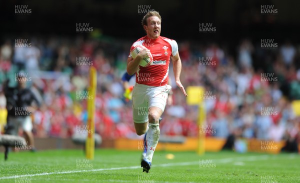 04.06.11 - Wales v Barbarians - DHL Challenge - Morgan Stoddart of Wales breaks away to score try. 