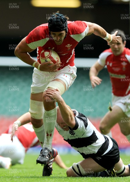 04.06.11 - Wales v Barbarians - DHL Challenge - Luke Charteris of Wales is tackled by Martyn Williams of Barbarians. 