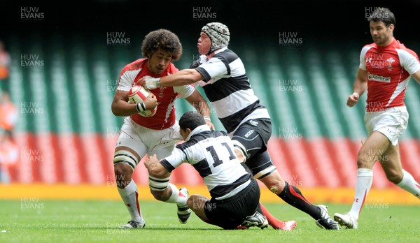 04.06.11 - Wales v Barbarians - DHL Challenge - Toby Faletau of Wales is tackled by Doug Howlett and Joe Van Niekerk of Barbarians. 