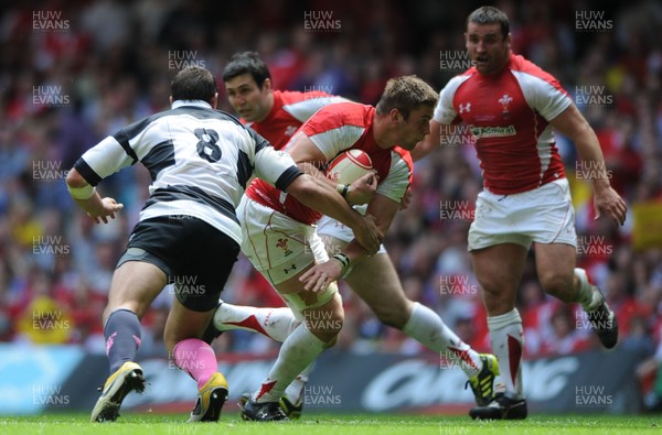 04.06.11 - Wales v Barbarians - DHL Challenge - Dan Lydiate of Wales is tackled by Sergio Parisse of Barbarians. 
