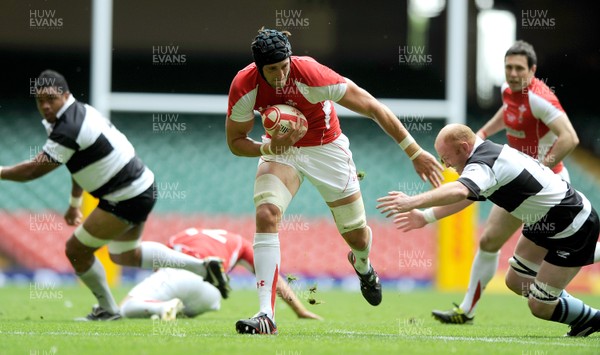04.06.11 - Wales v Barbarians - DHL Challenge - Luke Charteris of Wales gets past Martyn Williams of Barbarians. 