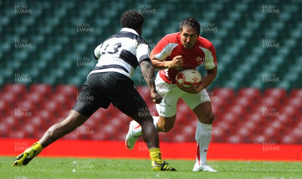 04.06.11 - Wales v Barbarians - DHL Challenge - Gavin Henson of Wales is tackled by Seru Rabeni of Barbarians. 