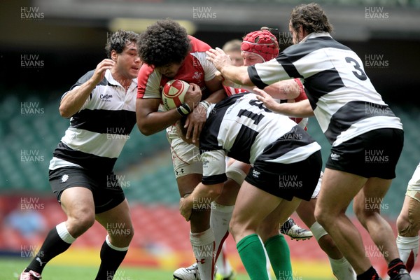 04.06.11 - Wales v Barbarians - DHL Challenge - Toby Faletau of Wales is tackled by George Smith, Leonardo Ghiraldini and Carl Hayman of Barbarians. 