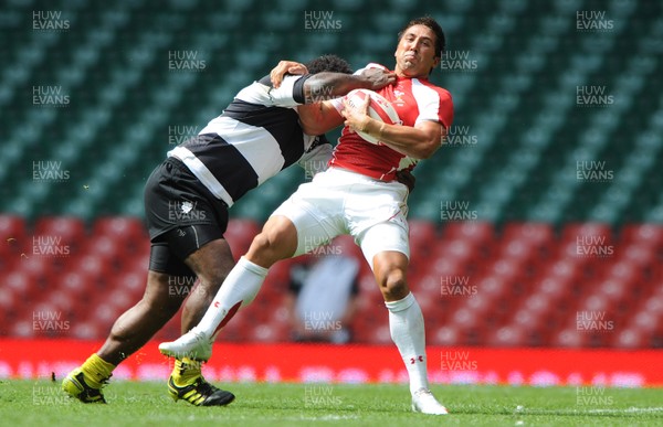 04.06.11 - Wales v Barbarians - DHL Challenge - Gavin Henson of Wales is tackled by Seru Rabeni of Barbarians. 