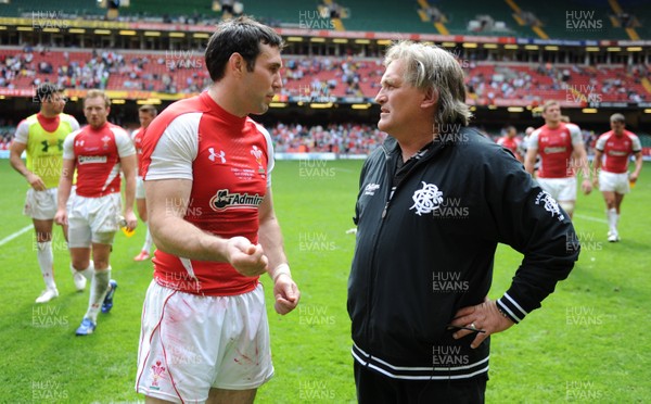 04.06.11 - Wales v Barbarians - DHL Challenge - Stephen Jones of Wales and Barbarians assistant coach Scott Johnson at the end of the game. 
