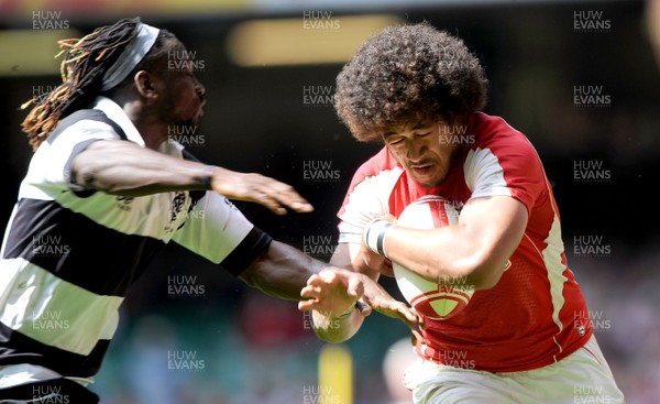 04.06.11 - Wales v Barbarians - DHL Challenge - Toby Faletau of Wales takes on Paul Sackey of Barbarians. 