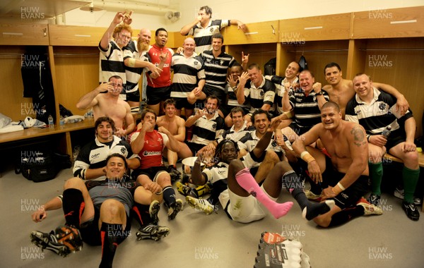04.06.11 - Wales v Barbarians - DHL Challenge - Barbarians players celebrate with the winners trophy in the changing rooms. 