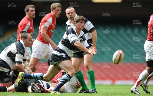04.06.11 - Wales v Barbarians - DHL Challenge - Lloyd Williams of Barbarians gets the ball away. 