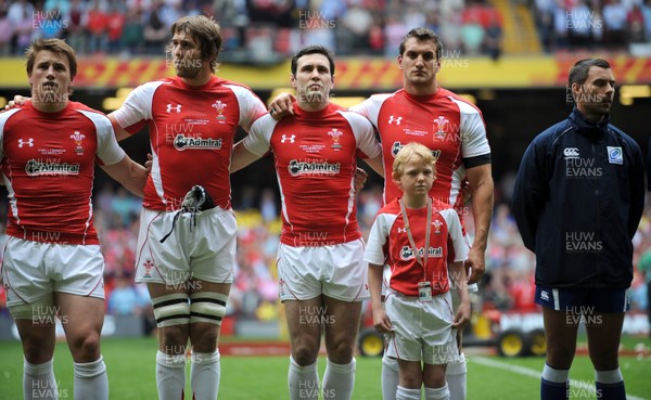 04.06.11 - Wales v Barbarians - DHL Challenge - Jonathan Davies, Ryan Jones, Stephen Jones and Sam Warburton of Wales line up for the national anthems with match mascot Thomas Hughes. 