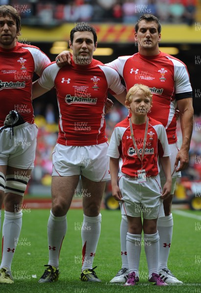 04.06.11 - Wales v Barbarians - DHL Challenge - Ryan Jones, Stephen Jones and Sam Warburton of Wales line up for the national anthems with match mascot Thomas Hughes. 
