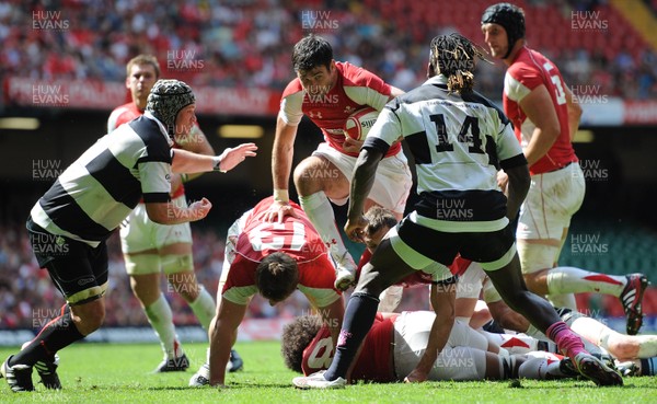 04.06.11 - Wales v Barbarians - DHL Challenge - Mike Phillips of Wales drives through. 