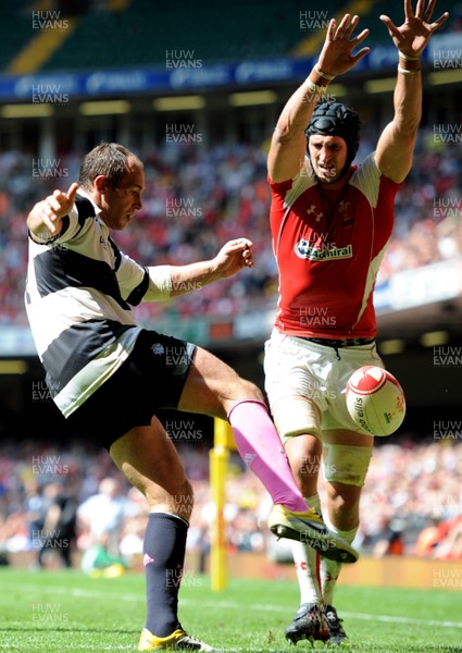04.06.11 - Wales v Barbarians - DHL Challenge - Sergio Parisse of Barbarians tries to clear past Luke Charteris of Wales. 