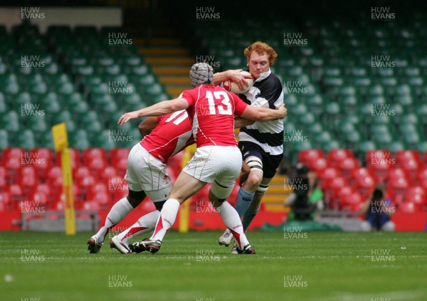 04.06.11 Wales v The Barbarians - DHL Challenge WRU 130th Anniversary Match - Barbarians' Paul Tito is tackled by Wales' Aled Brew(11) & Johnathan Davies.  