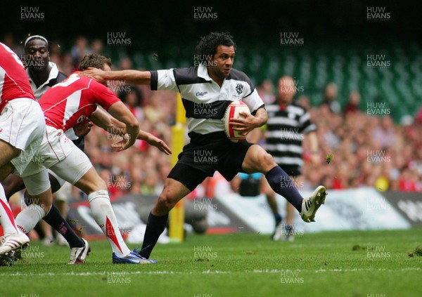 04.06.11 Wales v The Barbarians - DHL Challenge WRU 130th Anniversary Match - Barbarians' Isa Nacewa hands off Wales' Morgan Stoddart. 