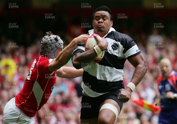 04.06.11 Wales v The Barbarians - DHL Challenge WRU 130th Anniversary Match - Barbarians' Iosefa Tekori powers through Wales' Johnathan Davies to score.  