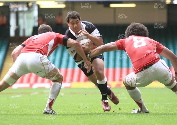 04.06.11 Wales v The Barbarians - DHL Challenge WRU 130th Anniversary Match - Barbarians' George Smith tries to force a way between Wales' Sam Warburton(L) & Toby Faletau. 
