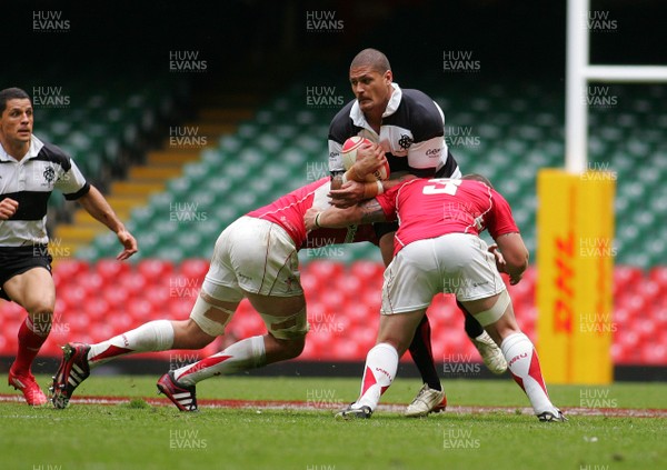 04.06.11 Wales v The Barbarians - DHL Challenge WRU 130th Anniversary Match - Barbarians' Willie Mason is tackled by Wales' Luke Charteris(L) & Paul James.  