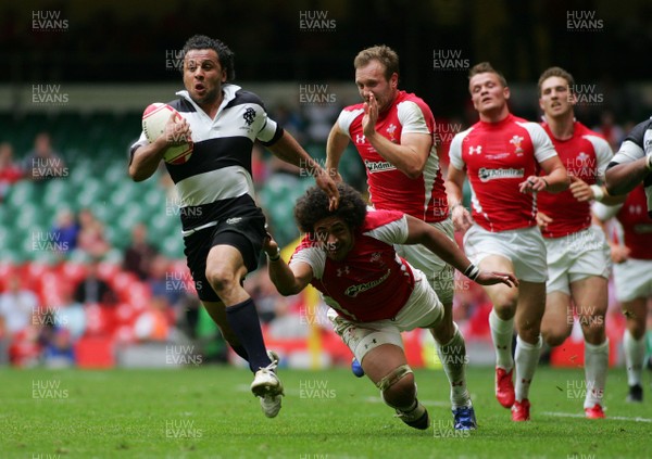 04.06.11 Wales v The Barbarians - DHL Challenge WRU 130th Anniversary Match - Barbarians' Isa Nacewa races away from Wales' Toby Faletau. 
