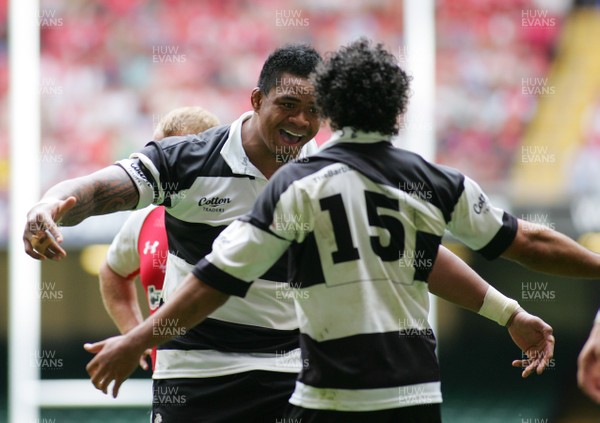 04.06.11 Wales v The Barbarians - DHL Challenge WRU 130th Anniversary Match - Barbarians' match winner Isa Nacewa(15) is congratulated by Iosefa Tekori. 