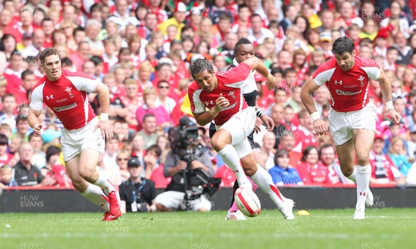 04.06.11 Wales v Barbarians... Wales' Gavin Henson gets past Mathieu Bastareaud of Barbarians. 