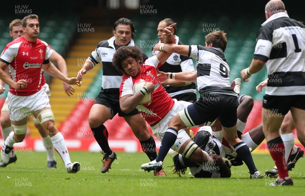 04.06.11 Wales v Barbarians... Toby Faletau of Wales is tackled by Paul Sackey of Barbarians. 