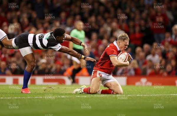 041123 - Wales v Barbarians - Sam Costelow of Wales gets the ball to score a try