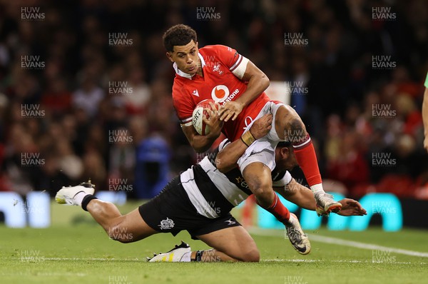 041123 - Wales v Barbarians - Rio Dyer of Wales is tackled by Angus Bell of Barbarians 