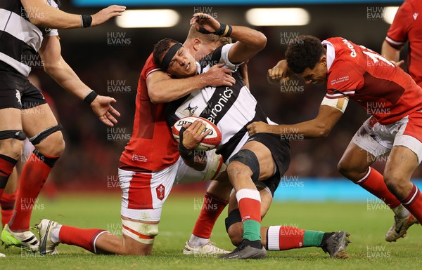 041123 - Wales v Barbarians - Aaron Shingler is tackled by Taine Plumtree of Wales 