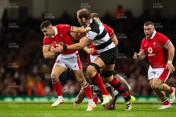 041123 - Wales v Barbarians - Tomos Williams of Wales is tackled by Alun Wyn Jones of Barbarians