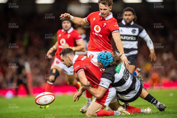 041123 - Wales v Barbarians - Tomos Williams of Wales is tackled by Justin Tipuric of Barbarians