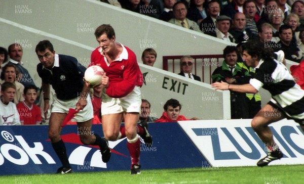 240896 - Wales v BarbariansRob Howley of Wales breaks pursued by Agustin Pichot