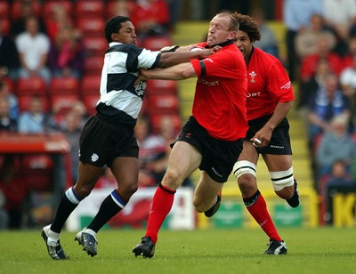 26.05.04  Barbarians v Wales, Bristol  Wales gareth Thomas hands off Breyton Paulse  Huw Evans,Cardiff