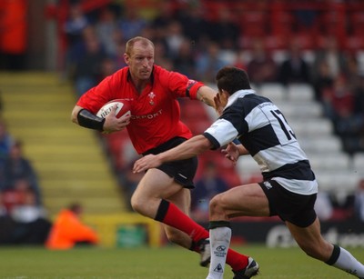 26.05.04  Barbarians v Wales, Bristol  Wales gareth Thomas hands off Damien Traille  Huw Evans,Cardiff