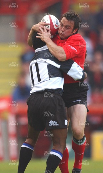 26.05.04  Barbarians v Wales, Bristol  Wales Rhys Williams is tackled by Breyton Paulse  Huw Evans,Cardiff