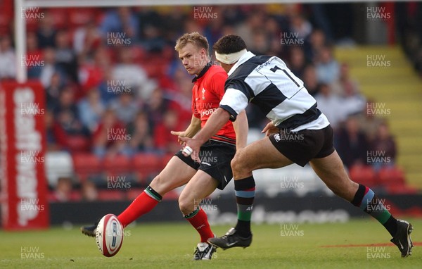 26.05.04  Barbarians v Wales, Bristol  Wales Dwayne Peel kicks past Andre Vos  Huw Evans,Cardiff
