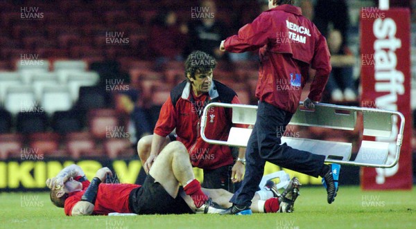 26-05-04. Wales v Barbarians. ASHTON GATE BRISTOL.  Wales' Gareth Thomas lies injured as medics rush to assist.  