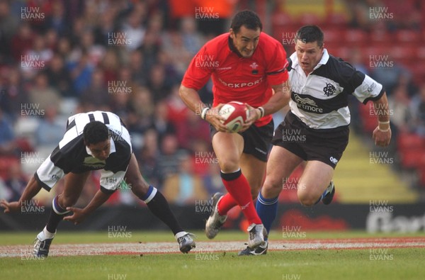 26.05.04  Barbarians v Wales, Bristol  Wales Sonny Parker gets past Breyton Paulse and Matthew Burke(rt)  Huw Evans,Cardiff