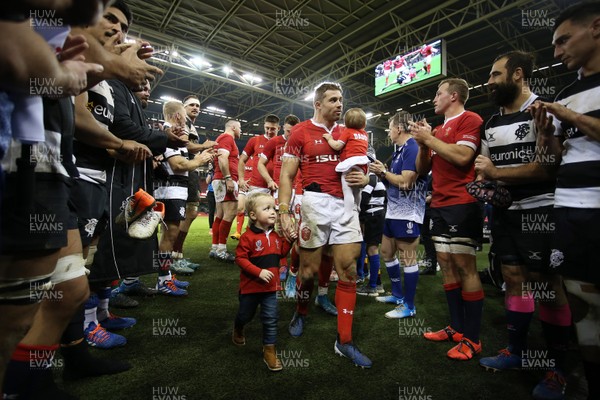 301119 - Wales v Barbarians - Leigh Halfpenny of Wales with his children walk through the tunnel