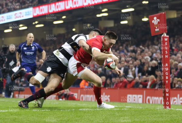 301119 - Wales v Barbarians, Principality Stadium - Josh Adams of Wales beats Shaun Stevenson of Barbarians as he reaches out to score try