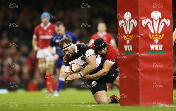 301119 - Wales v Barbarians, Principality Stadium - Craig Millar of Barbarians beats Leigh Halfpenny of Wales as he scores try