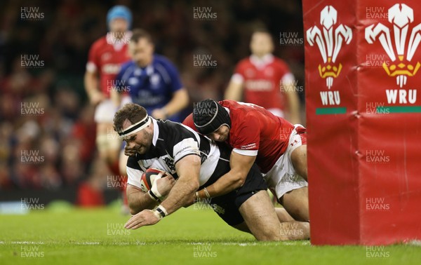301119 - Wales v Barbarians, Principality Stadium - Craig Millar of Barbarians beats Leigh Halfpenny of Wales as he scores try