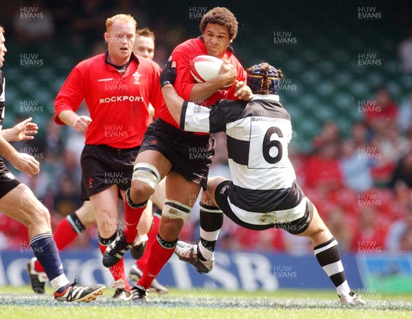 310503 - Wales v Barbarians - Wales' Colin Charvis takes on Sam Harding