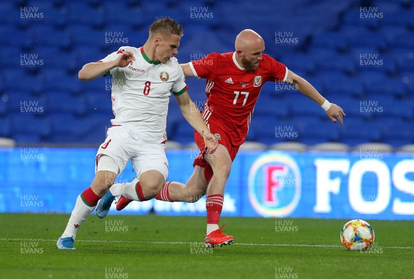 090919 - Wales v Belarus - International Friendly - Jonny Williams of Wales is challenged by Nikolai Zolotov of Belarus