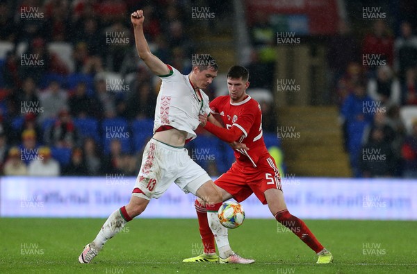 090919 - Wales v Belarus - International Friendly - Nikolai Signevich of Belarus is challenged by Chris Mepham of Wales