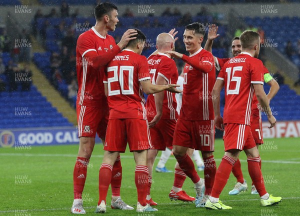 090919 - Wales v Belarus, International Challenge Match - Wales players celebrate with Daniel James of Wales after scoring goal