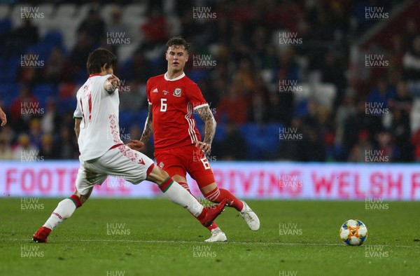 090919 - Wales v Belarus, International Challenge Match - Joe Rodon of Wales takes on Dmitri Baga of Belarus