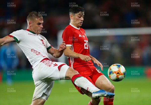 090919 - Wales v Belarus, International Challenge Match - Daniel James of Wales and Nikolai Zolotov of Belarus compete for the ball