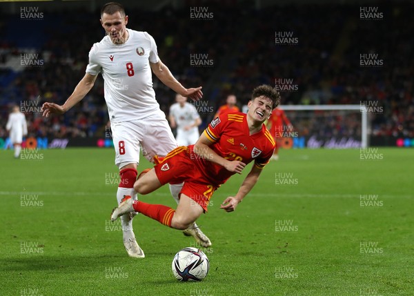 131121 - Wales v Belarus, 2022 World Cup Qualifying Match -  Daniel James of Wales is tackled by Aleksandr Selyava of Belarus