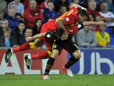 070912 - Wales v Belgium - FIFA 2014 World Cup Qualifying Match -    Wales' Hal Robson-Kanu is upended by Belgiums' Dries Mertens 